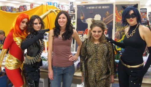 Cosplayers pose with the Action Flick Chick at Dallas Comic-Con.
